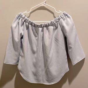 Off the shoulder baby blue blouse; lower it with bow in back
